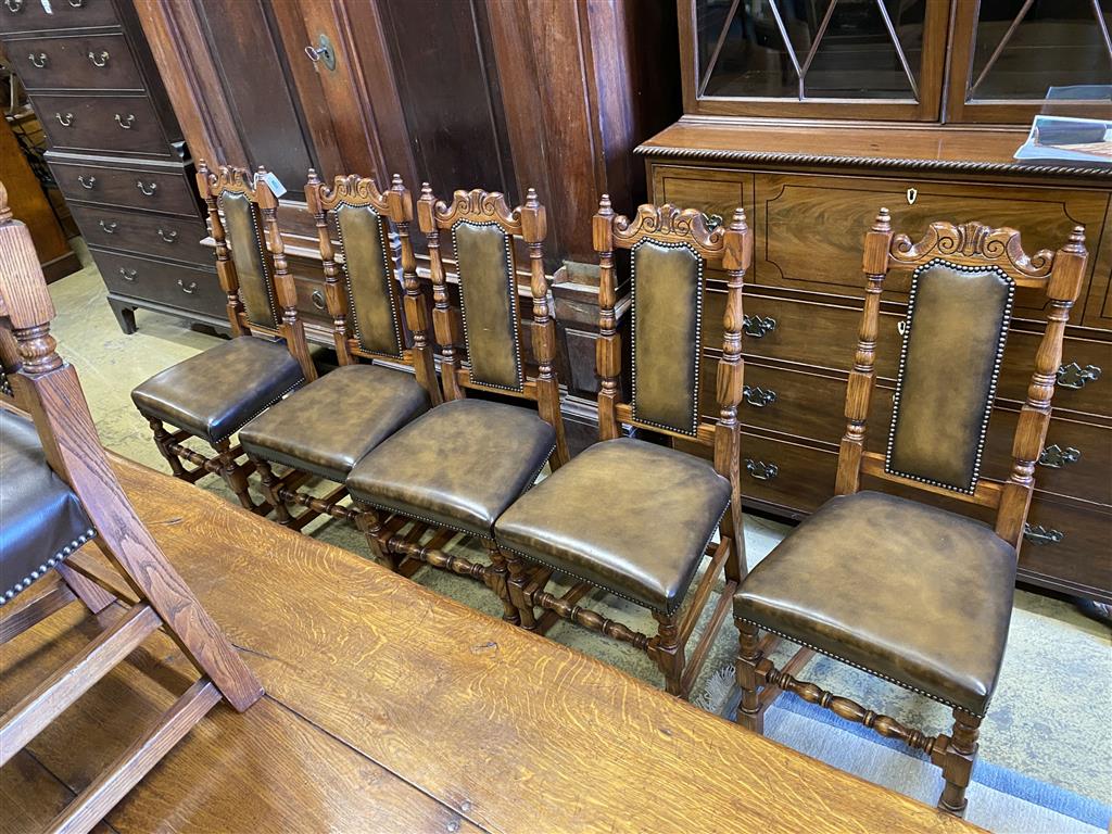 A set of ten 18th century style oak brown leather dining chairs (two with arms)